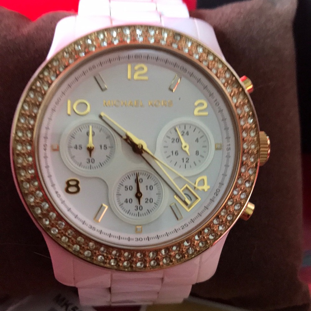 Michael Kors white ceramic watch.